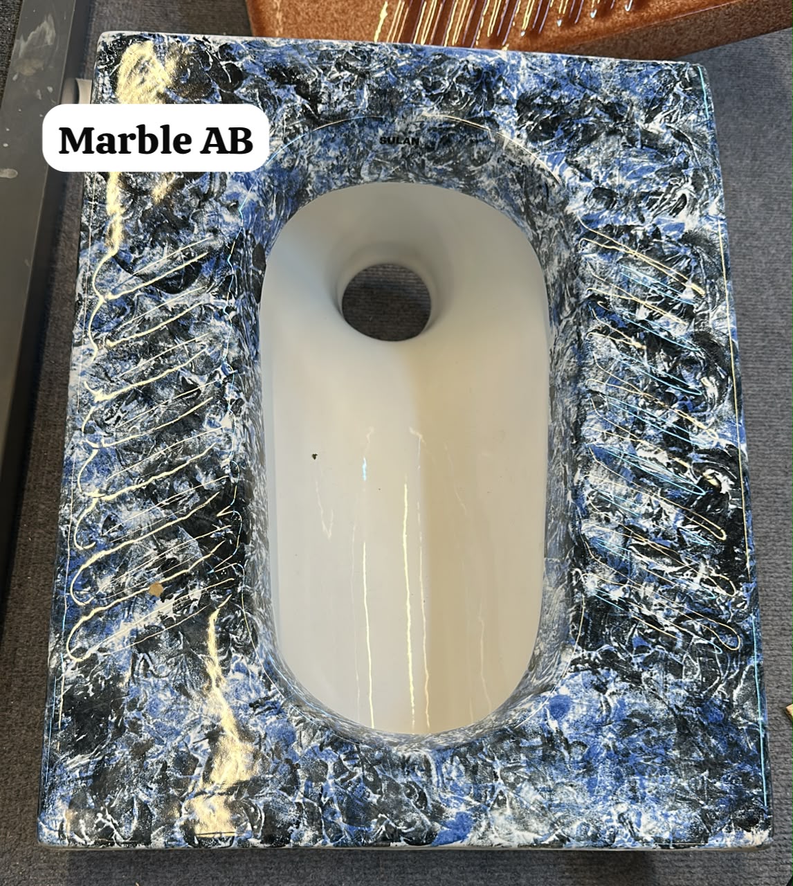 MARBLE SQUAT TOILET.